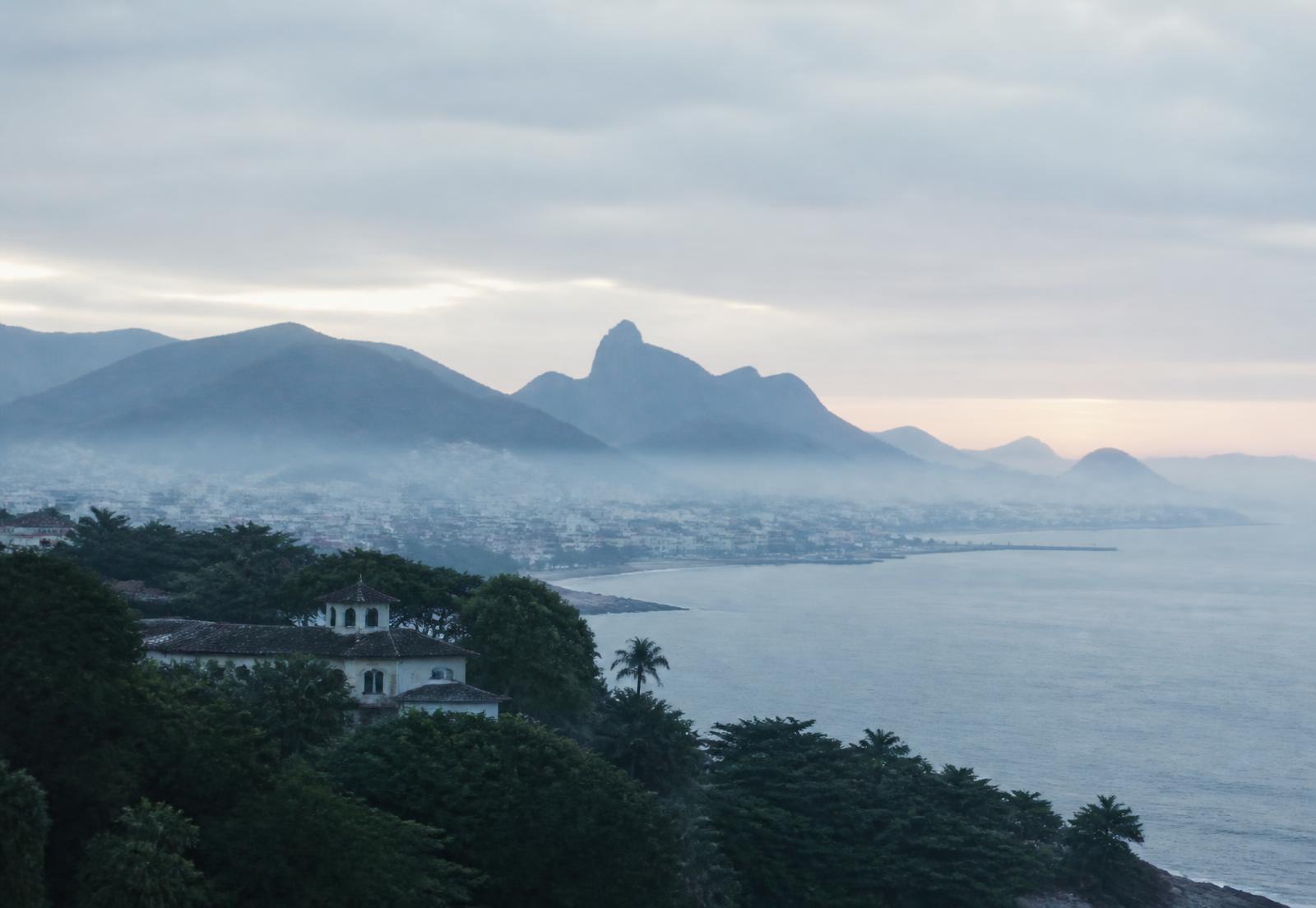 Coastal Venezuelan city at dawn under soft mist
